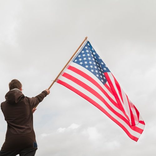 man-waving-american-flag