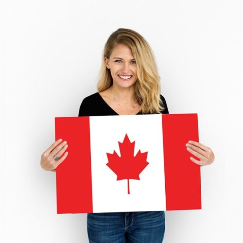 woman-hands-hold-canada-flag-patriotism